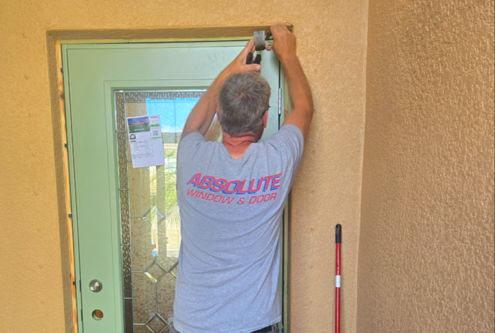 working on the installation of an entryway door